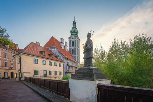 Lazebnicky Bridge with John of Nepomuk Statue and former Church of Saint Jost Tower - Cesky Krumlov, Czech Republic
