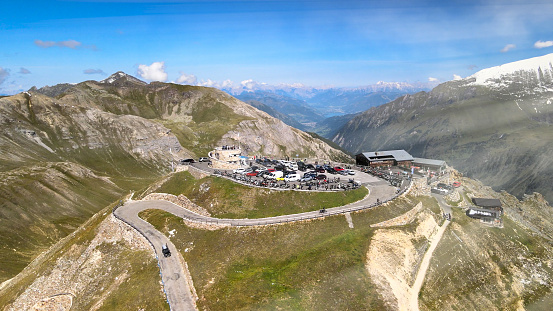 Amazing aerial view of Grossglockner mountain peaks covered by snow in summer season. Drone viewpoint over Edelweiss Spitze