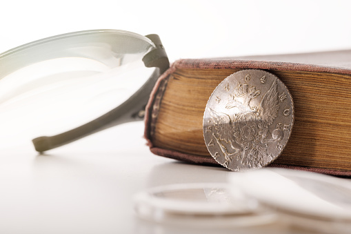 Numismatics. Old collectible coins on the table.