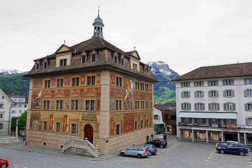Schwyz, Switzerland - May 09, 2016: The Town Hall walls paintings commemorates the celebration of 600 years Swiss Confederation since the 19th century. The building itself was built in 17th century