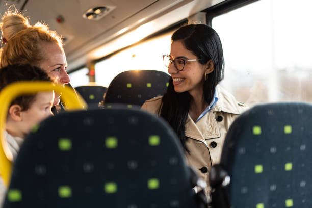 istock Two female friends whit child in bus 1456010763
