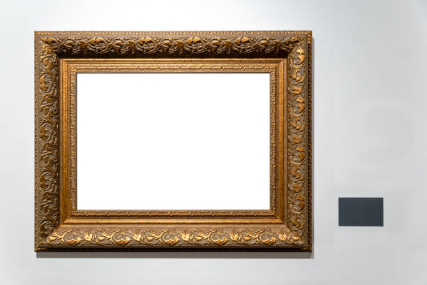 istock Golden vintage frame isolated on white wall in museum. 1456012226