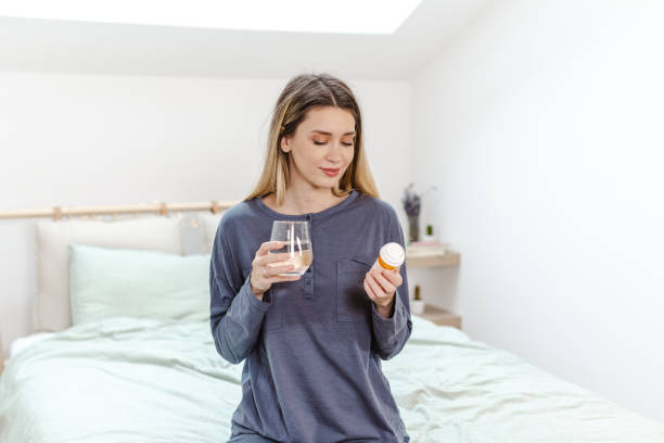 istock Young woman taking medicines 1456012746