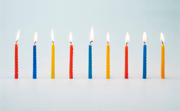 istock Lit colorful birthday cake candles 1456013653