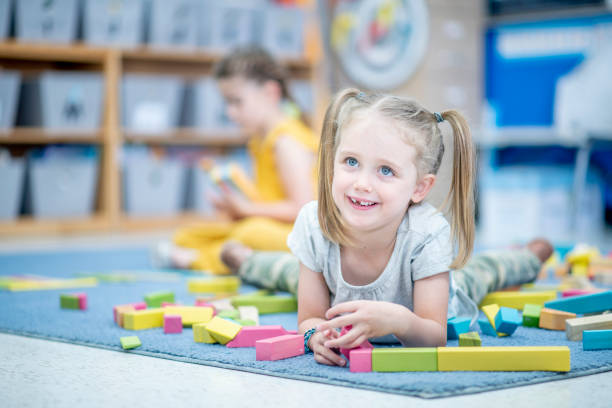 istock Little Girl Playing with Blocks 1456017226