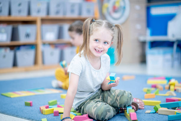 istock Little Girl Playing with Blocks 1456017241