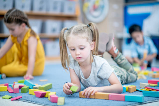 istock Little Girl Playing with Blocks 1456017243