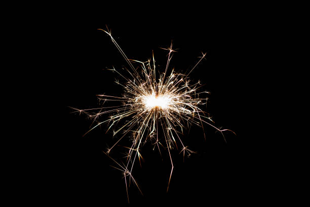 istock Burning sparkler isolated on black background. Fireworks theme. Light effect and texture. 1456018504