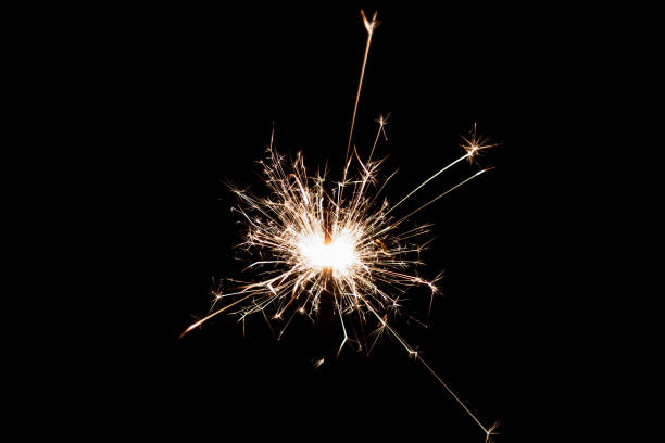 istock Burning sparkler isolated on black background. Fireworks theme. Light effect and texture. 1456018505