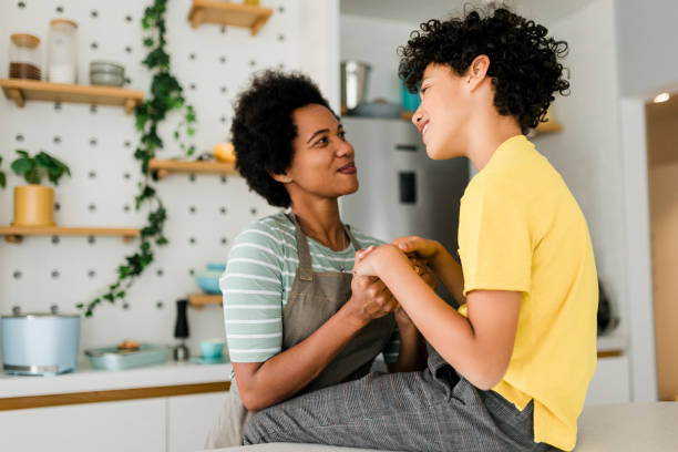 istock Cheerful young boy, loved by his mother and loving her back. 1456018641
