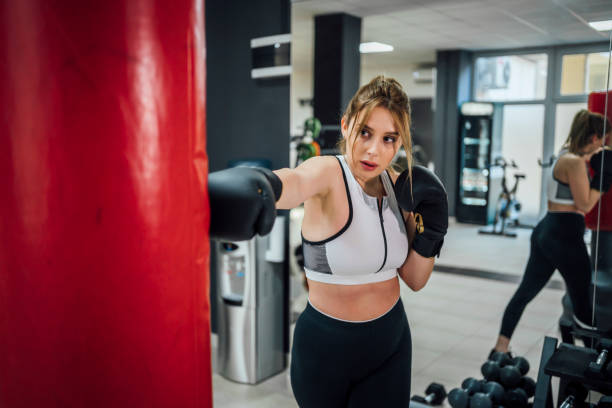istock Female boxer practicing in the gym 1456019650
