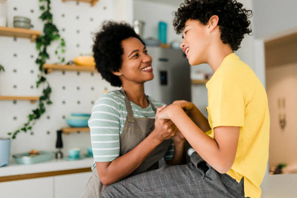 istock Cheerful young boy, loved by his mother and loving her back. 1456021632