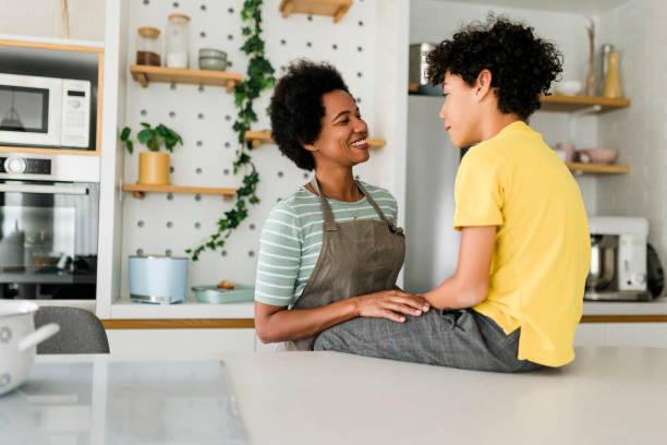 istock Cheerful young boy, loved by his mother and loving her back. 1456021652