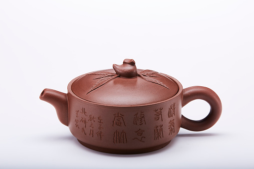 Chinese clay teapot isolated on white background.