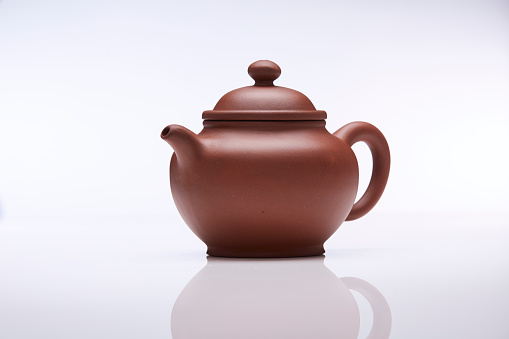 White ceramic tea pot isolated on white background with clipping path.
