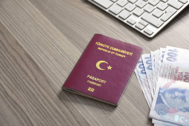istock Turkish passport and Turkish lira banknotes on the table 1456022972
