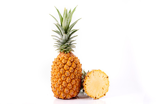 single pineapple on wood background
