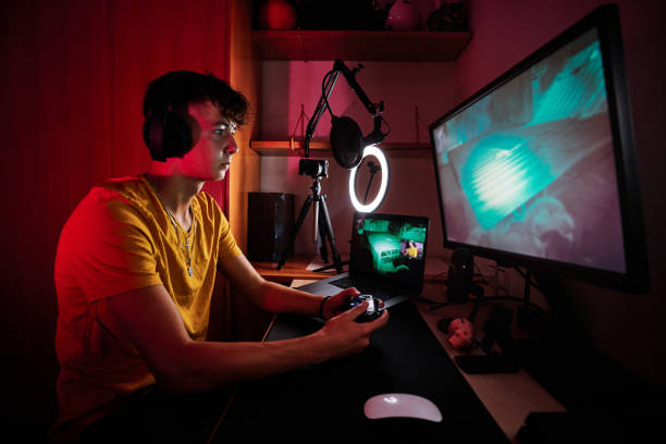 istock Concentrated gamer playing in the room 1456023195