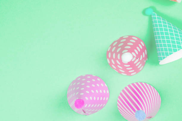 istock Colorful birthday caps on a blue background. Top view. 1456025142