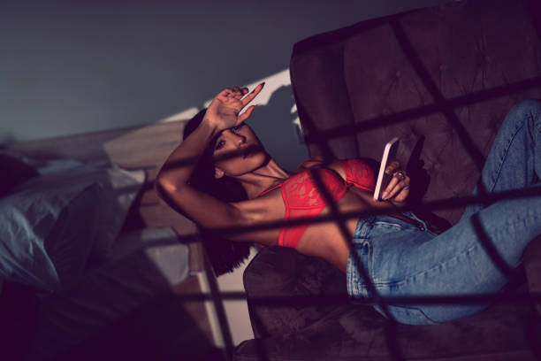 istock Relaxation Time In Shadows For Beautiful Female With Smartphone 1456026291