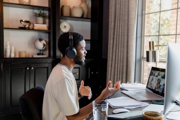 istock Young businessman leads virtual team meeting 1456028720