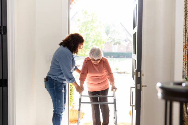 istock Mature daughter helps senior mom manage mobility walker 1456028865