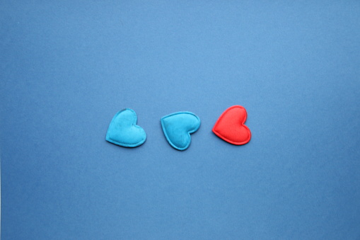 Hearts on a blue background. Holiday creative background.