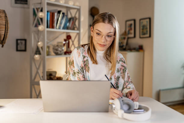 istock Young woman working at home 1456031272