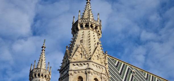 istock Steeples in Vienna Stephansdom two towers with roof 1456032574