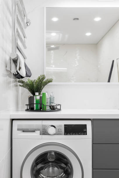 istock basin, Soap Press, flower vase Set in a clean, white and light gray bathroom. 1456033176