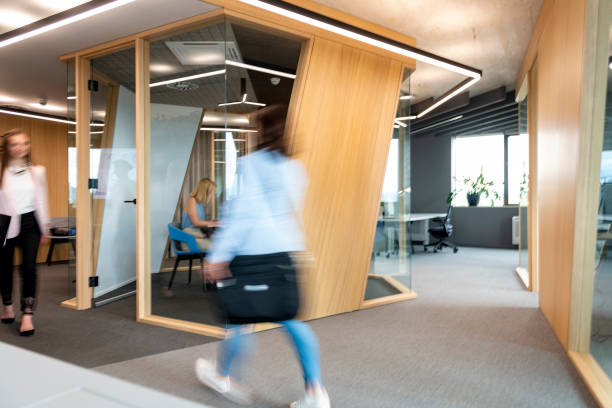 Business People Walking Down The Hallway