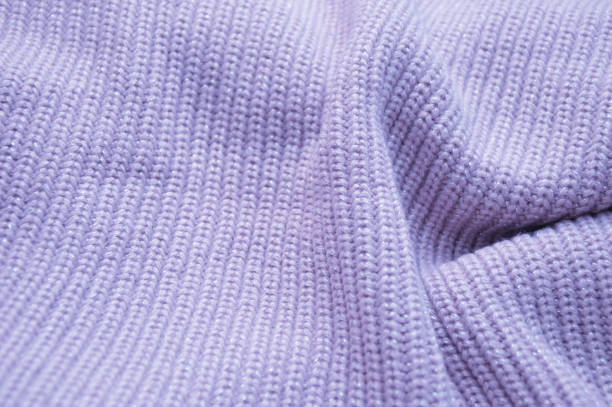 istock Lilac knitted texture background. Knitted fabric handmade. Abstract background. 1456035752