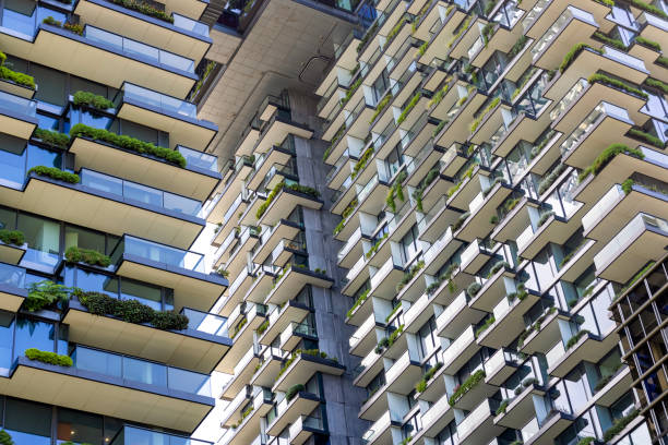 istock Low angle view of apartment buildings with vertical gardens, background with copy space 1456038000