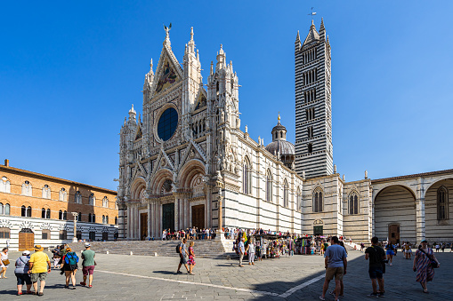 Siena, Italy – August 18, 2021: Siena, Italy, Aug. 2021 - Exterior of Siena Cathedral (Duomo di Siena), built in 13th century in Gothic style