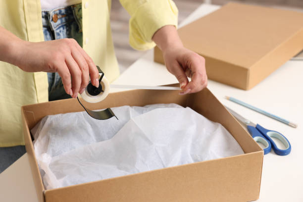 istock Seller preparing package at workplace, closeup view 1456039389