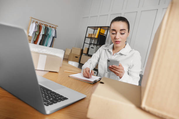 istock Seller working at table in office. Online store 1456039438