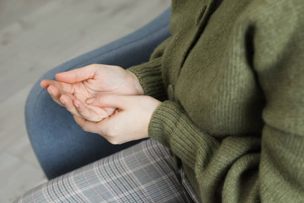 istock Woman suffering from trigger finger at home, closeup 1456040099