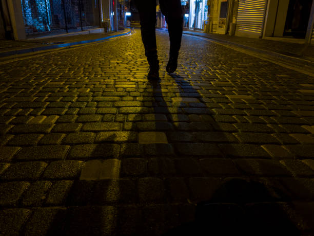 istock walking on wet parquets after rain and light colors reflected on cobblestones 1456041540