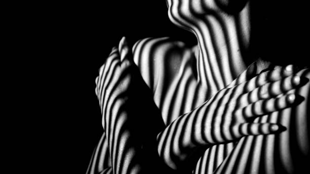istock Female body in stripes 1456042469
