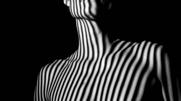 istock Female body in stripes 1456042489