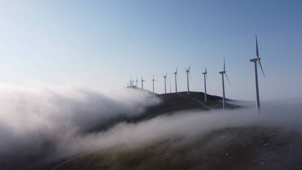 istock eolic generators on the top of a cloudy mountain 1456044484