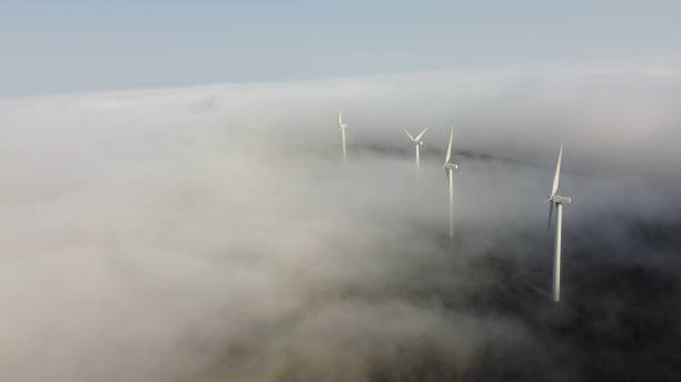 istock eolic generators on the top of a cloudy mountain 1456044486