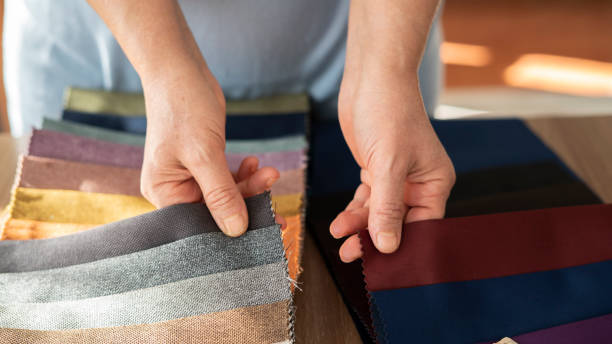 istock Close-up Female customer choosing fabric texture and color 1456045832