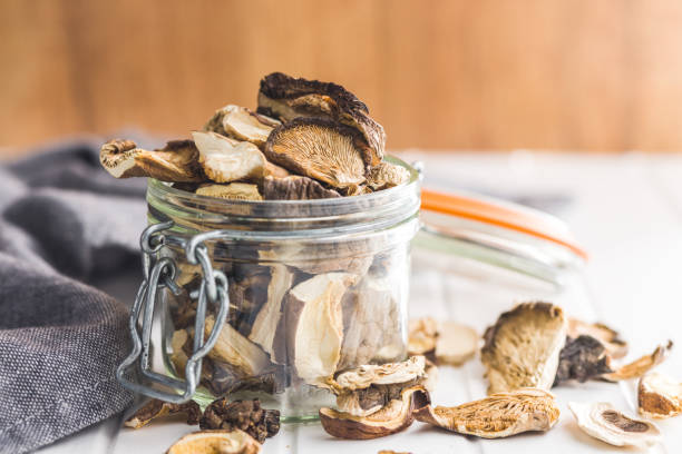 istock Sliced dried mushrooms in jar. 1456045855