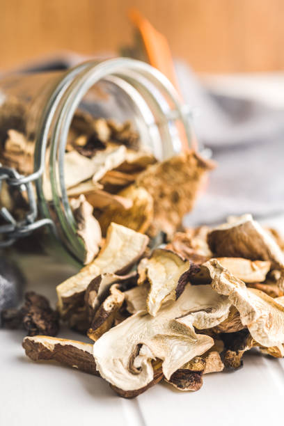 istock Sliced dried mushrooms in jar. 1456045861
