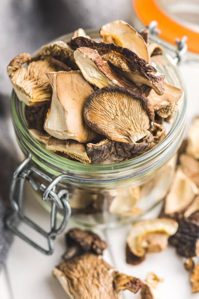 istock Sliced dried mushrooms in jar. 1456045862