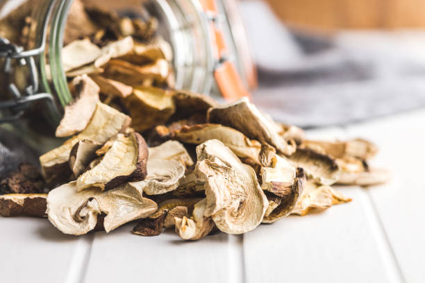 istock Sliced dried mushrooms in jar. 1456045879