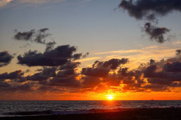 istock Sunset on the beach with beautiful clouds 1456047712
