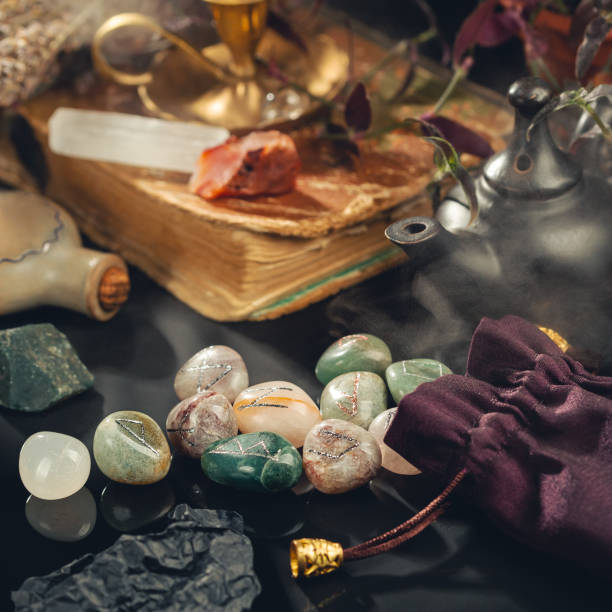 Magic Tools for Divination Ritual on the Table Magic Tools for Divination Ritual on the Table in the Mystical Fog Around. Square Composition Carved Carnelian stock pictures, royalty-free photos & images