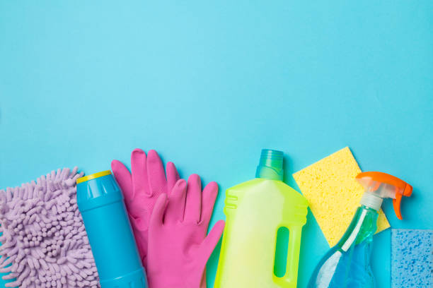 istock Many different house cleaning products on color background, top view 1456050338
